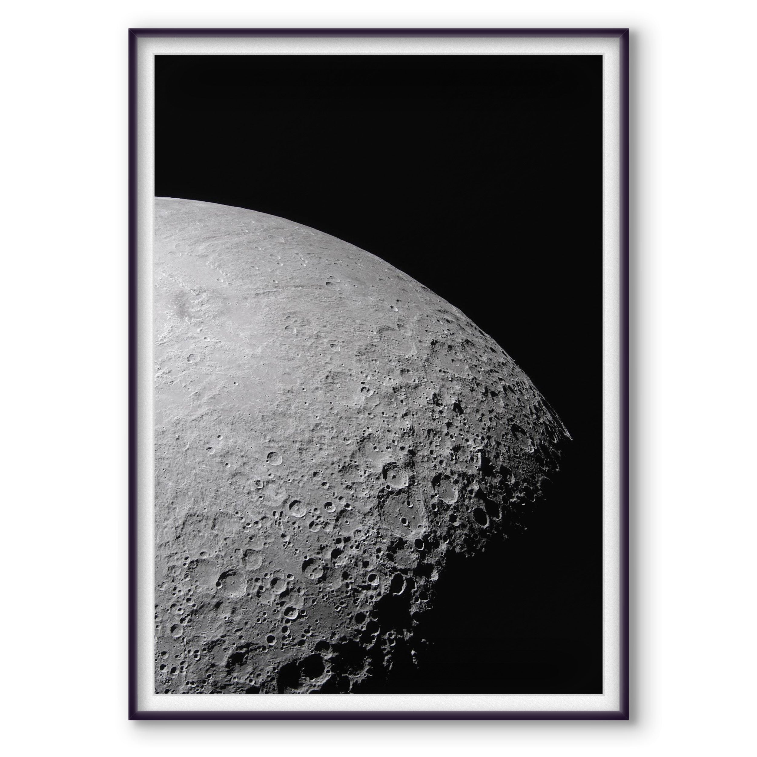 A portion of the Moon’s farside photographed at the terminator, with long shadows and part of Orientale Basin visible near the edge of light.
