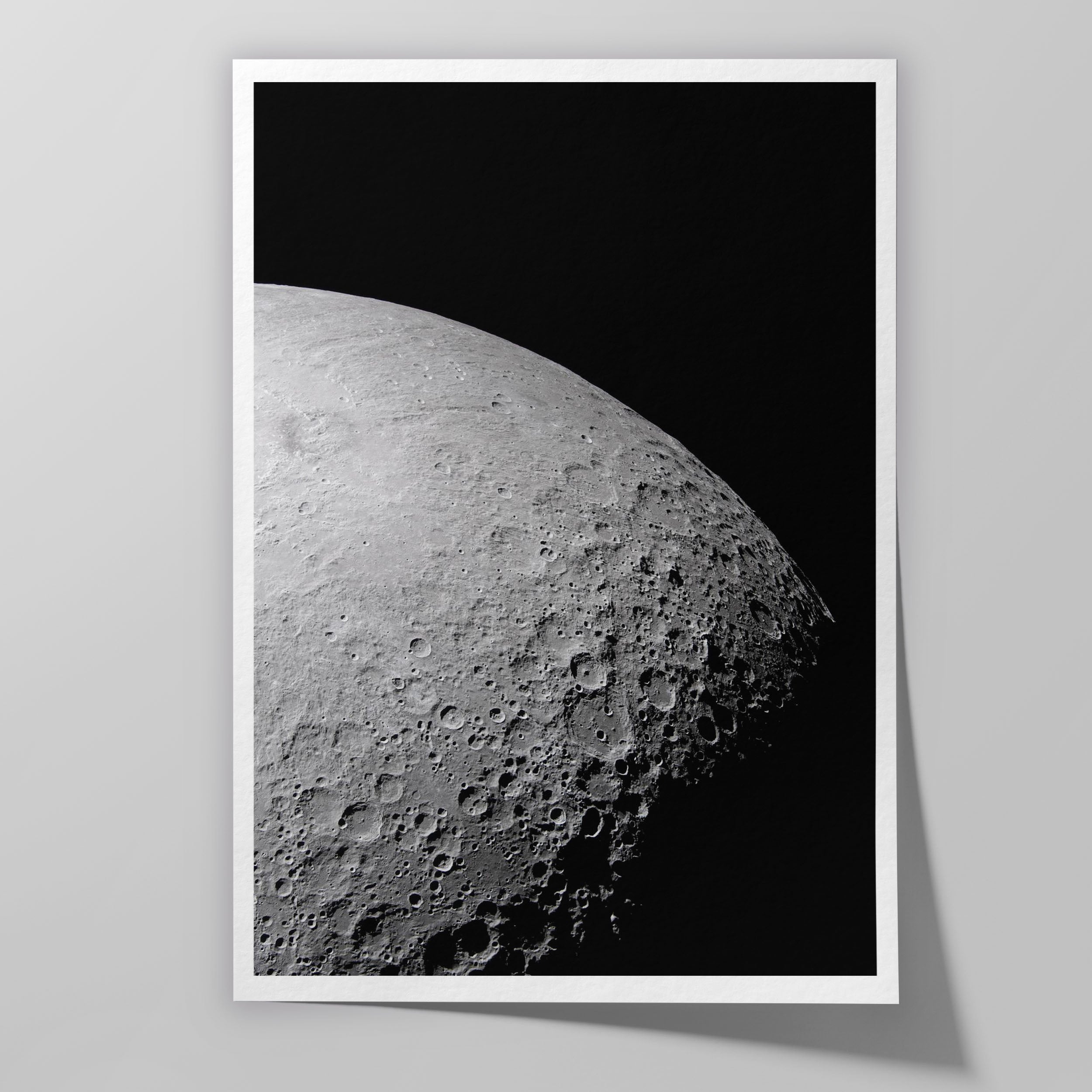 A portion of the Moon’s farside photographed at the terminator, with long shadows and part of Orientale Basin visible near the edge of light.
